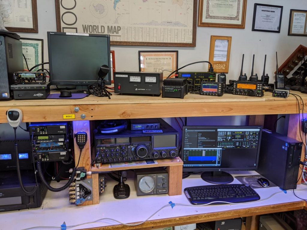 HF Station including an Elecraft KX3 for remote operations and Yaesu FTDX9000 for in-person operations. Desktop in lower right runs software for remote HF operations.